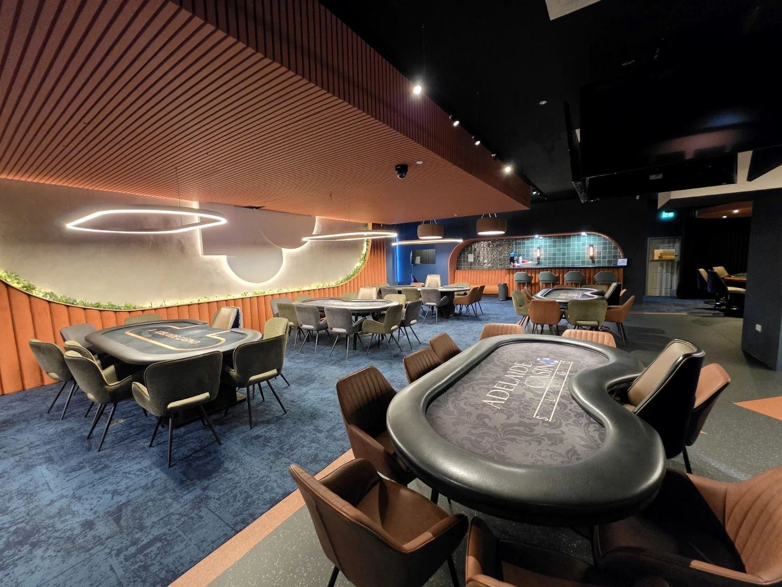 Poker and seating area with Adelaide tables and stylish lighting